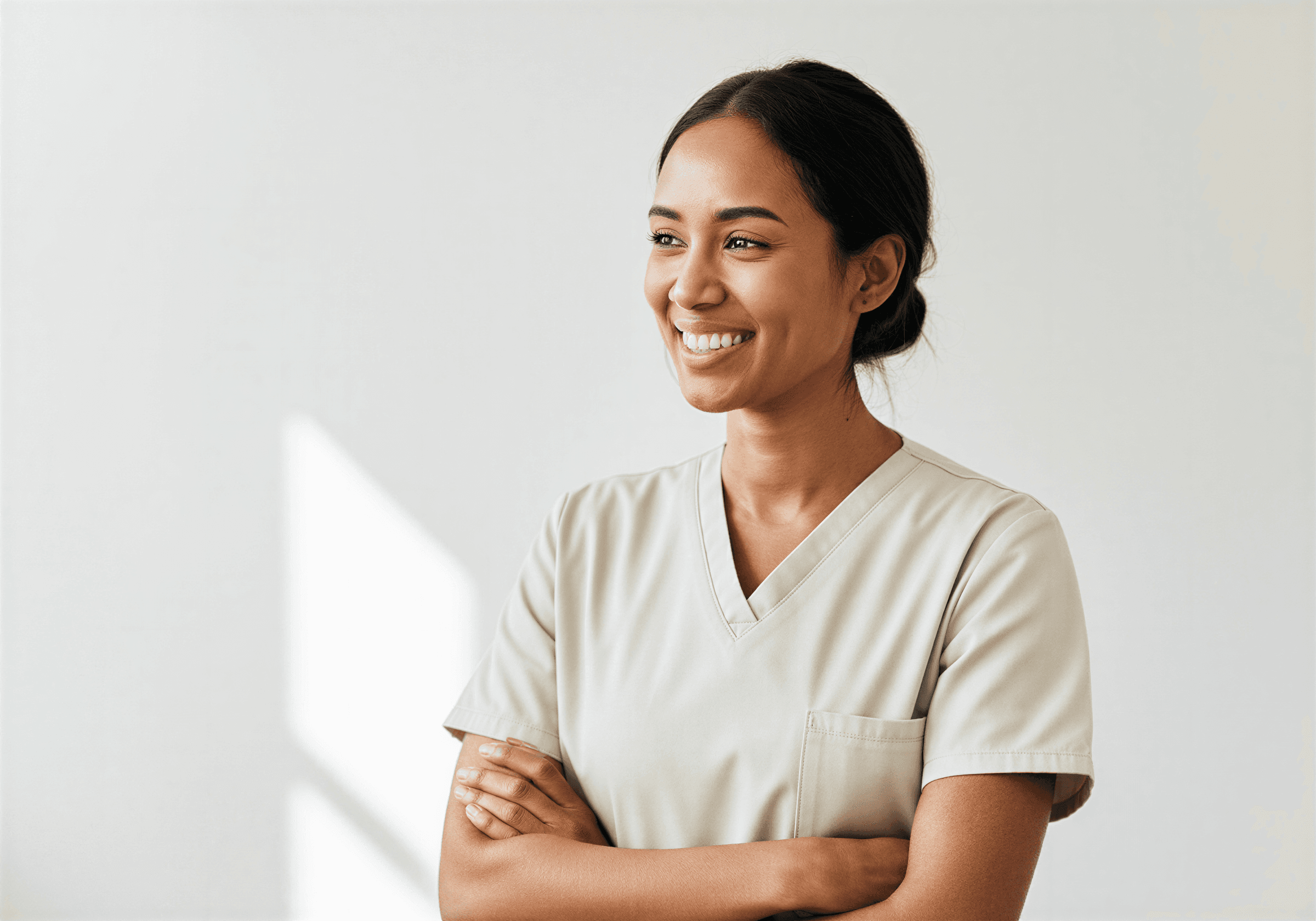 Smiling healthcare provider in scrubs