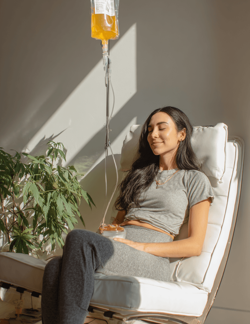 A client relaxing during an IV therapy session, in a clinic running Reviva IV therapy clinic software
